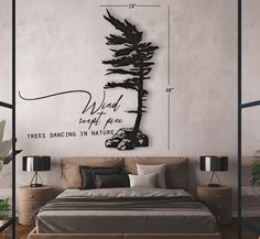 a bedroom with a bed, nightstands and wall hanging above it is an image of a tall pine tree