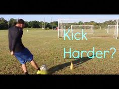 a man kicking a soccer ball in front of a goalie net with the words kick harder on it