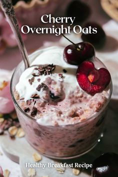 cherry overnight oats in a glass with cherries on top