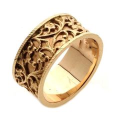 a gold ring with filigrees on it