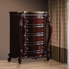 a chest of drawers sitting next to a window