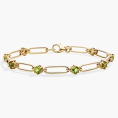 Opt for simple elegance when you wear this paper clip bracelet beautifully crafted from gleaming 14k yellow gold. A brightly gleaming peridot stone nestles between each link, adding eye-catching sparkle and color. Paper Clip Bracelet, Paperclip Bracelet, Precious Gemstones Jewelry, Peridot Stone, Blue Nile, Simple Elegance, Gemstone Bracelets, Paper Clip, Semi Precious Gemstones