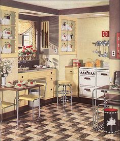 an old fashioned kitchen with yellow cabinets and checkered flooring on the tile floors