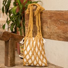 To create this stylish and practical cotton tote, El Salvador's Fatima Dawson draws inspiration from her homeland's traditional matata bags used in rural areas to carry essentials and work tools. This stunning design comes with an ivory drawstring bag made from manta fabric encapsulated within a fishing net-like macrame bag in a lovely honey shade. Perfect for a relaxing day at the beach, running errands or shopping, this tote bag is sure to leave a lasting impression. Eco-friendly Macrame Tote Shoulder Bag, Eco-friendly Macrame Bag For Everyday Use, Eco-friendly Macrame Tote Bag, Bohemian Cotton Bag With Braided Handles, Cream Macrame Crochet Bag For Everyday Use, Natural Color Macrame Bags For Daily Use, Natural Macrame Bag For Daily Use, Cream Macrame Bag For Everyday Use, Eco-friendly Macrame Shoulder Bag For Daily Use