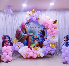 balloon decorations and balloons in front of a backdrop