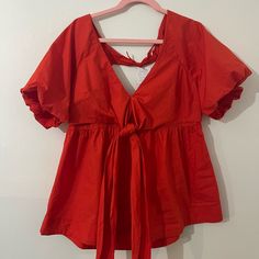 This Is A Loose Fitting, Very Flattering, Deep, Orange Summer Blouse. It Has An Empire Waist Which Cinches In The Back. It Has An Open Back. Brand New With Tags. Red V-neck Blouse Relaxed Fit, Red Cotton Blouse For Brunch, Relaxed Fit Short Sleeve Blouse For Brunch, Red V-neck Tops For Brunch, Red Short Sleeve Blouse For Daywear, Red V-neck Top For Brunch, Red Tops For Spring Daywear, Deep Orange, People Women