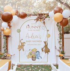 a winnie the pooh baby shower with balloons