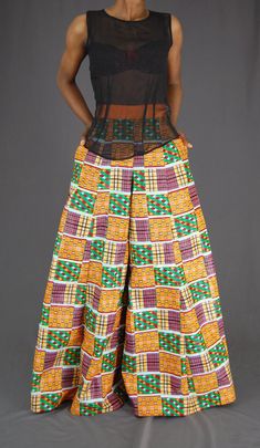 "African print Princess seam pants 27-28\" waist measurement 27.5 2\"  orange contour waist band. 2 sides pockets 7\" back invisible zipper Leg opening 56\" Inseam 33\" Hips about  36-38\"" African Print Pants High Waist, Fit And Flare Pants, African Pants, African Print Pants, African Print Jumpsuit, Trousers Wide Leg, High Waist Trousers, Black Wide Leg Pants, Pants Fit