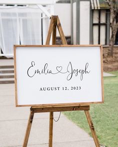 a wooden easel holding a sign that says, entia and joseph