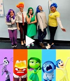 four people standing in front of a wall with cartoon characters