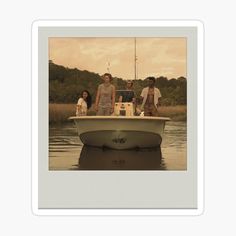 three people are sitting on a boat in the water