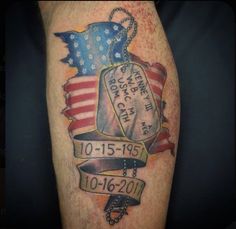 an american flag tattoo on the arm with a memorial tag and chain attached to it