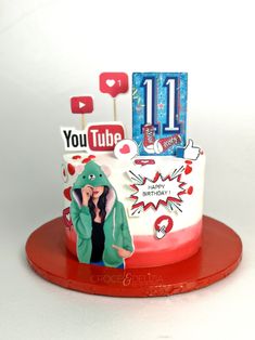 a birthday cake with an image of a woman on top and the number 11 on it