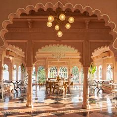 an ornately decorated dining room with chandeliers