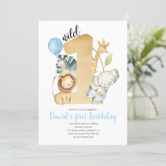 a first birthday card with an elephant, giraffe and zebra on the number one