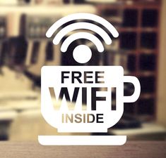 a coffee cup with the words free wifi inside is shown in front of a blurry background