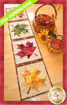 a table runner with autumn leaves on it