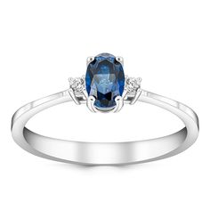 a white gold ring with an oval blue sapphire and diamonds