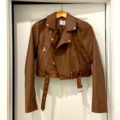 Brown Faux Leather Moto Jacket. Brand New, Never Worn. Lining Is 100% Polyester And Shell Is 92% Polyester And 8% Cotton. Hand Wash Cold Water. Size Medium And Fits Size 2 To 4. Brown Moto Jacket, Faux Leather Moto Jacket, Leather Moto, Leather Moto Jacket, Rue 21, Rue21, Moto Jacket, Cold Water, Size 2