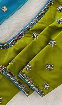 green and blue sari with beading on it