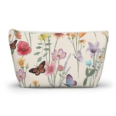 an image of a cosmetic bag with flowers and butterflies on the front, white background