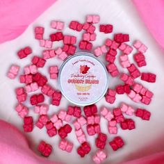 pink sugar cubes sitting on top of a white plate