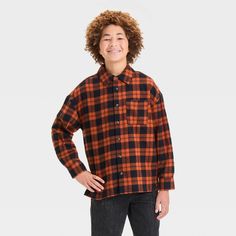 This Long-Sleeve Button-Up Flannel Shirt from Cat & Jack™ makes a timeless addition to your child's closet. Made from midweight cotton, this wrinkle-resistant shirt is adorned with a plaid pattern for a touch of evergreen style. It features a front button placket, long sleeves with buttoned cuffs, a patch pocket on the chest and a box-pleat back yoke for classic touches. The regular fit with a shirttail hemline that hits below the hip completes the design and allows them to wear it tucked in or Plaid Tops For School In Fall, Collared Tops For School In Fall, Fall School Button-up Tops, Button-up Fall Tops For School, Fall Button-up Tops For School, Button Closure Tops For School In Fall, Relaxed Fit Tops For School In Fall, Shirt Art, Orange Plaid