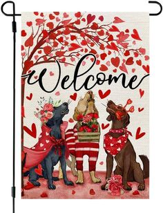 a welcome flag with three dogs in front of a tree and heart - shaped leaves