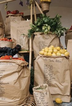 several bags filled with fruits and vegetables on top of a table