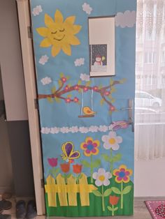 the door is decorated with flowers and birds