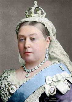 an old photo of a woman wearing a tiara