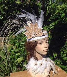 "This is a sample of what we can make for you. Neck piece is not included. All Costumes are made to order! OPTION-- You can also change the feathers to your own color except white feathers. change the band color to any color you like. NOTE- please message us if you like to change to all white feathers, white feathers will cost you a lot more, so message us so we can discuss the price. :) MEASUREMENT Headpiece height is 3\" tall. Feathers measures- 8\"- 10\" long/length. 7\" flower. LISTING ONE H Bohemian Carnival Headband, Bohemian Headpieces For Mardi Gras Carnival, Bohemian White Headband Headpiece, White Bohemian Headband, White Bohemian Ceremonial Headpiece, White Bohemian Handmade Headband, White Handmade Bohemian Headband, Handmade White Bohemian Headband, White Headpieces For Carnival Festival