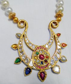 Vintage antique 23 K solid gold and natural Navratna gemstones set large pendant strung together with pearls and gold beads. Great one of type collection piece in very good condition. Length-Free size, Size of pendant-10/9 cm, gross weight-137 grams, pendant weight only-76 grams, Material-23 K gold, Natural uncut Diamonds, and Natural Navratna gemstones. Traditional Kundan Pearl Necklace In Yellow Gold, Traditional Yellow Gold Kundan Pearl Necklace, Diwali Pearl Pendant Necklace, Kundan Temple Jewelry Necklace With Round Gemstone Beads, Temple Jewelry Style Kundan Necklace With Gemstones, Gold Kundan Pearl Pendant Necklace, Gold Multi-stone Kundan Temple Necklace, Gold Kundan Multi-stone Temple Necklace, Gold Kundan Chandbali Necklace With Pearl Pendant