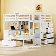 a white bunk bed with stairs and desk in the corner, next to a yellow wall