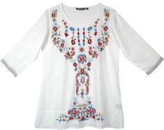 a white top with colorful embroidered details on it