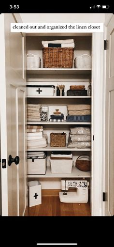 an open closet with baskets, towels and other items