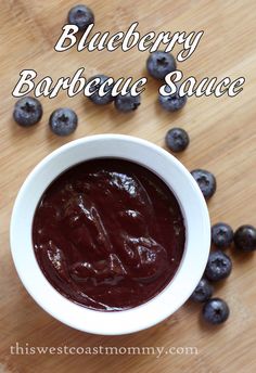 blueberry barbecue sauce in a white bowl surrounded by fresh blueberries