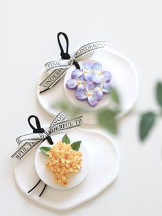 two small plates with flowers on them