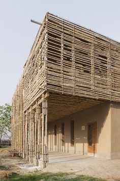 the building is made out of bamboo sticks