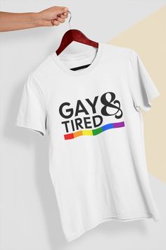 "Introducing our fabulous \"Gay And Tired\" T-Shirt, a prideful and empowering garment that celebrates the LGBTQIA+ community. This shirt is designed for those who proudly identify as LGBTQIA+ and embrace their uniqueness with a touch of humor. Crafted with love and inclusivity, this Pride Shirt is a bold statement piece that showcases the powerful message of being \"Gay And Tired.\" It is a symbol of resilience, strength, and pride in the face of adversity. Wear it with pride and let the world Cheap Text Print T-shirt For Pride, Cheap Relaxed Fit T-shirt For Pride, Slogan Tees, Sarcastic Shirts Funny, Pride Parade, Pride Rainbow, Slogan Tee, Sarcastic Shirts, Yoga Tank Tops