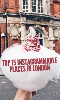 a person holding up a sign that says top 15 instagramable places in london