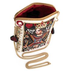 All hail the queen when you wear the couture queen of hearts playing card beaded mini masterpiece. Get ready for handbag envy! 6.25 x 0.75 x 9.25" Strap Length End to End: 49" Strap Drop: 23" Removable crossbody chain strap, zipper closure, inside pocket, back pocket, metal logo fob, fits a phone This is a handmade item, each one an individual work of art. Slight variations may occur. Learn More about our Global Impact Weird Handbags, Lizzie Hearts, Novelty Bags, Heart Bag