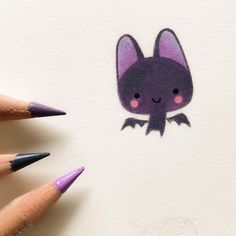 a drawing of a bat with pink eyes and two pencils in front of it