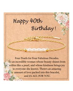 a happy birthday card with a gold chain bracelet and pearls on the end of it