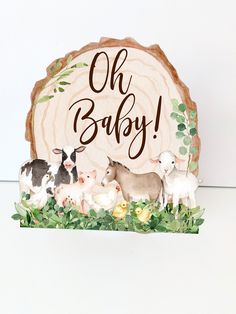 a wooden sign that says oh baby with farm animals