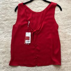 Vibrant Red Tank Top From Mango With A Relaxed Fit And Light, Flowy Fabric. Features A Low Back With Tie And Button Details. Size Xs But Can Fit Size S Nwt Red Sleeveless Blouse For Day Out, Sleeveless Red Blouse For Day Out, Chic Red Top For Beach, White Cotton Pajamas, Jeans Tank Top, Red Tank Top, Orange Tank Top, Flowy Fabric, Mango Tops