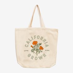 California Grown Tote Bag From hot deserts and dense forests to snowy mountains and coastal highways, California has it all. Decorated with the iconic California poppy, this tote bag is for California natives, tourists and travelers. The California Collection Clothing and provisions inspired by the Golden State. California's stretch of land is vast and bountiful. Just when we think we'd seen it all, there's more around the corner. This collection is dedicated to the love of exploring California and what it has to offer. Specs Reusable bag 100% cotton twill Budget dimensions - 15.75"h x 15.25"w; Approx. 240 cubic inches Conventional dimensions - 14"h x 14"w x 3"d, Approx. 588 cubic inches Cooling Blanket, California Poppy, Sticker Patches, Snowy Mountains, Sock Shop, Gift Card Shop, Reusable Bags, Golden State, Hat Shop