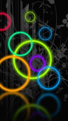 an abstract wallpaper with circles and lines in the middle, on a black background