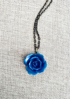 "A romantic dusty blue colored  flower cabachon pendant adorns this perfect little necklace! On an antique bronze chain *necklace measures 18\" *flower measures approximately 1\"" Blue Rose Necklace, Cheap Handmade Blue Flower Necklace, Blue Flower Necklace, Bronze Chain Necklace, Romantic Necklace, Romantic Jewelry, Romantic Jewellery, Rose Necklace, Wedding Formal