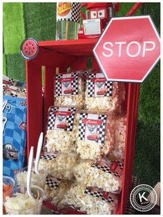 a stop sign next to a shelf filled with popcorn